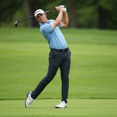 Professional golfer executing a powerful downswing, golf course background, focus on body alignment and club position